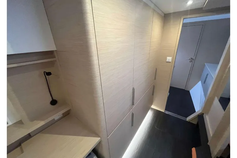 Fonn Taistil Domhain Yacht Photos Pics Modern interior of 2025 Fountaine Pajot 41 yacht with sleek wood finishes and ambient lighting.