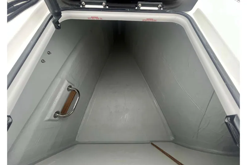 Fonn Taistil Domhain Yacht Photos Pics Storage compartment of 2025 Fountaine Pajot 41 yacht, featuring sleek interior design.