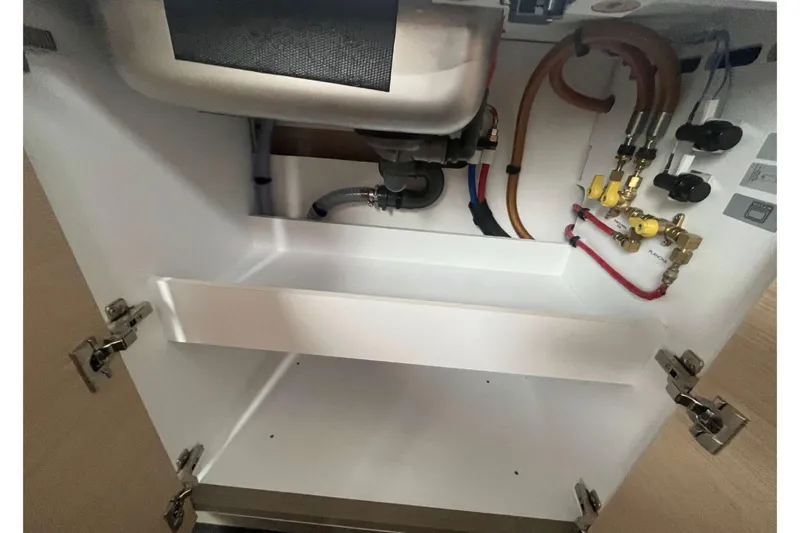 Fonn Taistil Domhain Yacht Photos Pics Under-sink plumbing and valves in 2025 Fountaine Pajot 41 yacht.