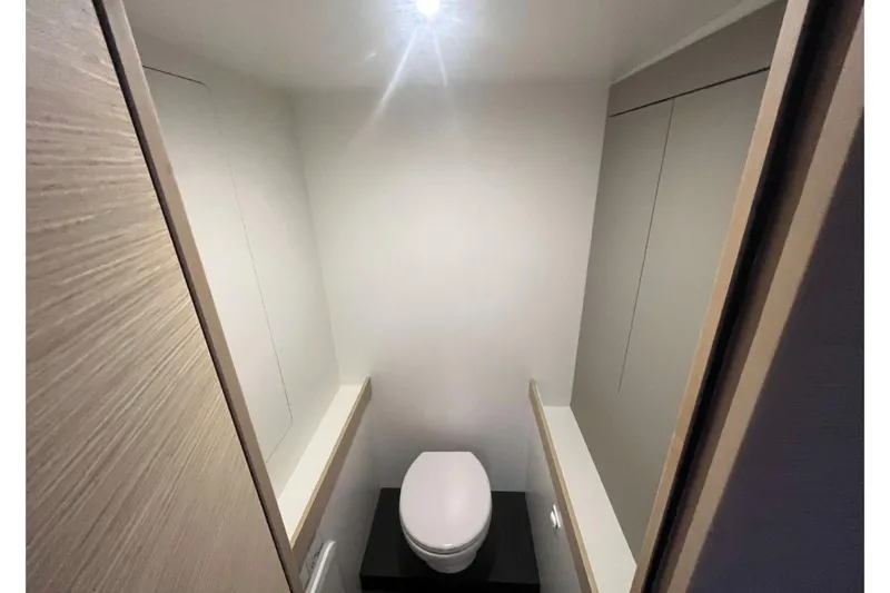 Fonn Taistil Domhain Yacht Photos Pics 2025 Fountaine Pajot 41 yacht bathroom with modern toilet and minimalist design.
