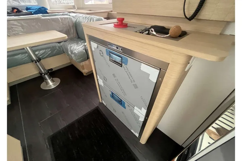 Fonn Taistil Domhain Yacht Photos Pics Interior of 2025 Fountaine Pajot 41 yacht, featuring modern kitchen and seating area.