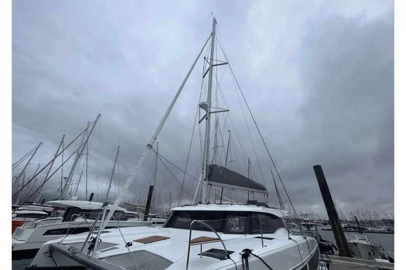 Fonn Taistil Domhain Yacht Photos Pics 2025 Fountaine Pajot 41 catamaran docked under cloudy skies.