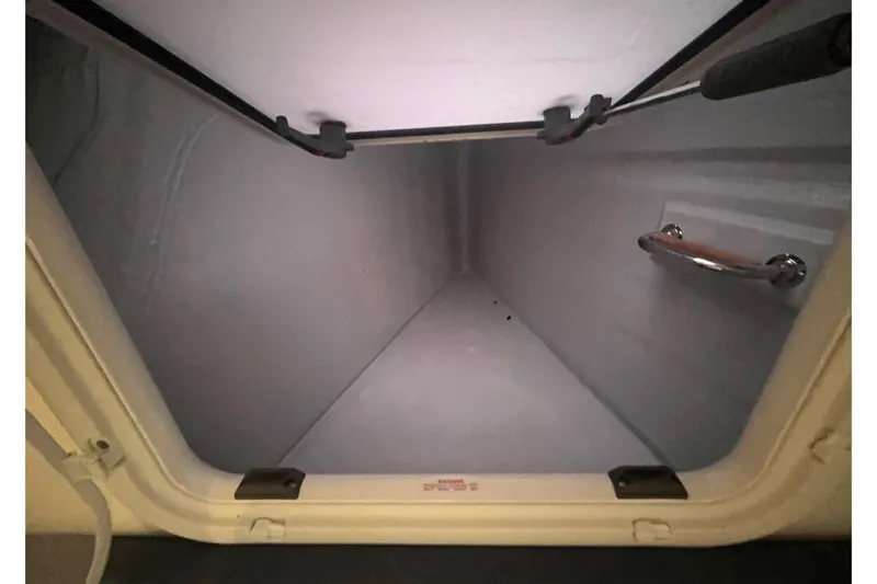 Fonn Taistil Domhain Yacht Photos Pics Storage compartment inside 2025 Fountaine Pajot 41 yacht, featuring a secure handle.