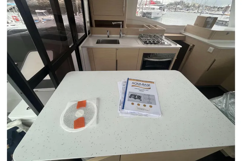 Fonn Taistil Domhain Yacht Photos Pics Modern kitchen interior of 2025 Fountaine Pajot 41 yacht with stove and sink.