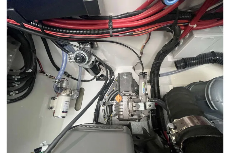 Fonn Taistil Domhain Yacht Photos Pics Engine compartment of 2025 Fountaine Pajot 41, showcasing wiring and mechanical components.
