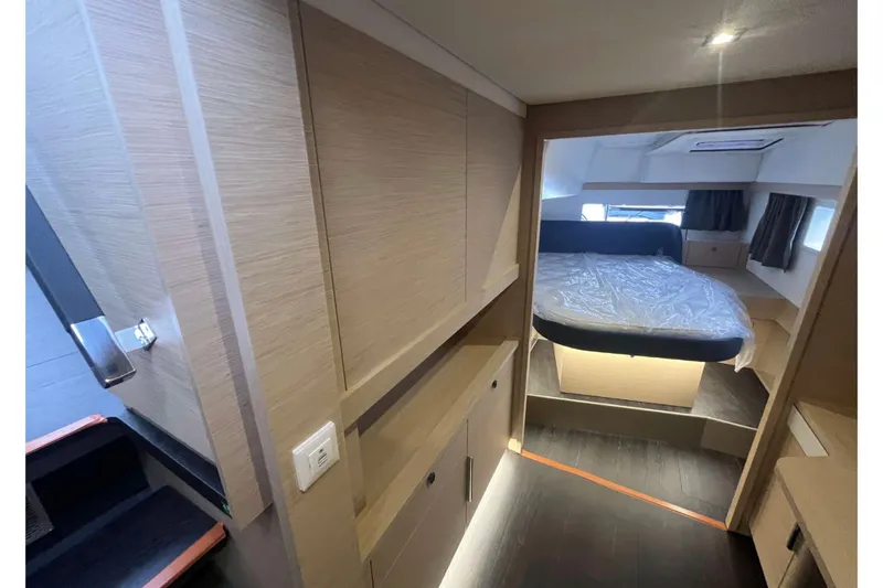 Fonn Taistil Domhain Yacht Photos Pics Luxurious interior of 2025 Fountaine Pajot 41 yacht with modern bedroom design.