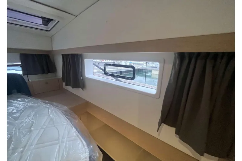 Fonn Taistil Domhain Yacht Photos Pics Interior cabin of 2025 Fountaine Pajot 41 yacht with window view.