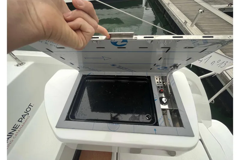 Fonn Taistil Domhain Yacht Photos Pics Outdoor grill on 2025 Fountaine Pajot 41 catamaran, docked at marina.