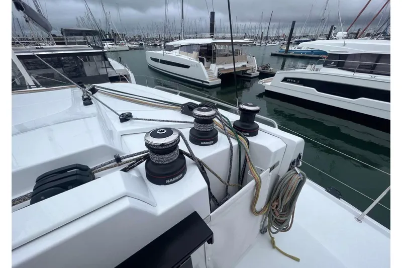 Fonn Taistil Domhain Yacht Photos Pics 2025 Fountaine Pajot 41 catamaran in marina, showcasing winches and rigging.