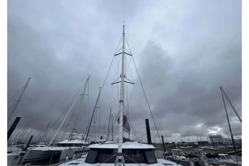 Fonn Taistil Domhain Yacht Photos Pics 2025 Fountaine Pajot 41 catamaran docked under cloudy skies.