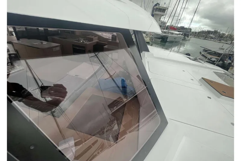 Fonn Taistil Domhain Yacht Photos Pics 2025 Fountaine Pajot 41 yacht, showcasing sleek design and marina view.
