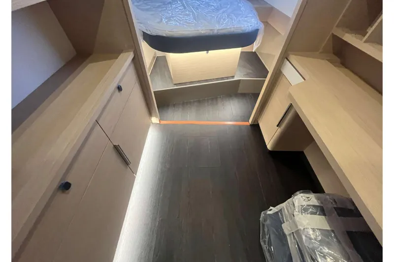 Fonn Taistil Domhain Yacht Photos Pics Interior of 2025 Fountaine Pajot 41 yacht, featuring modern wood cabinetry and sleek design.