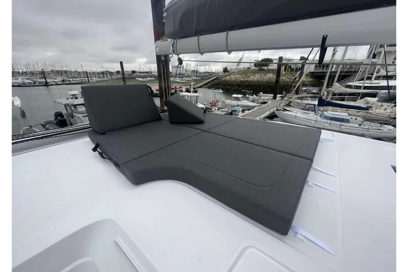 Fonn Taistil Domhain Yacht Photos Pics 2025 Fountaine Pajot 41 yacht with cushioned deck seating at marina.