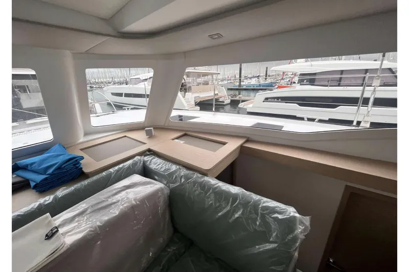 Fonn Taistil Domhain Yacht Photos Pics Interior view of 2025 Fountaine Pajot 41 yacht with marina in background.