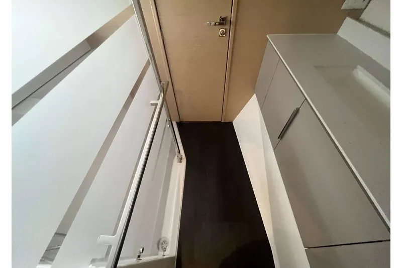 Fonn Taistil Domhain Yacht Photos Pics Interior of 2025 Fountaine Pajot 41 yacht, featuring modern cabinetry and sleek design.