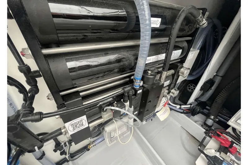 Fonn Taistil Domhain Yacht Photos Pics Engine compartment of 2025 Fountaine Pajot 41 yacht, showcasing mechanical components and tubing.