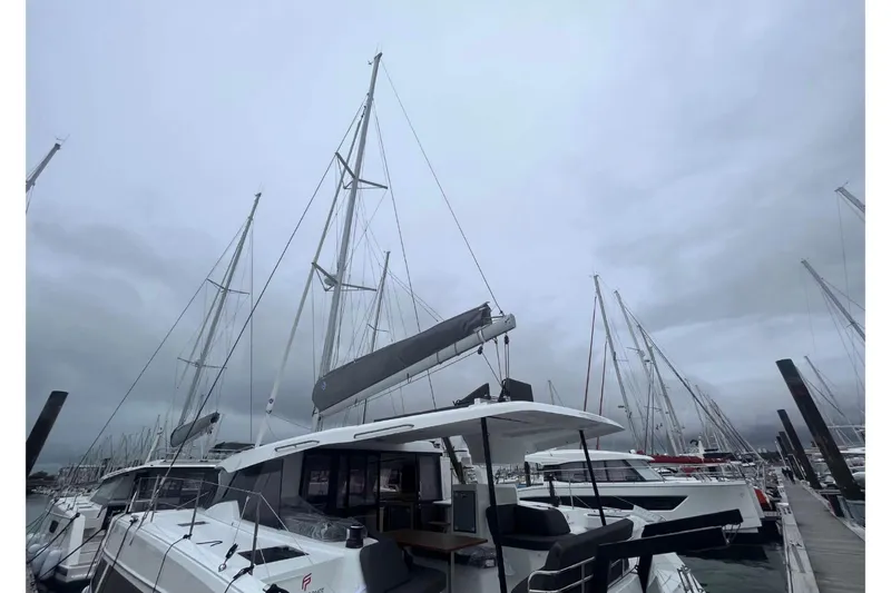 Fonn Taistil Domhain Yacht Photos Pics 2025 Fountaine Pajot 41 catamaran docked at marina under cloudy sky.