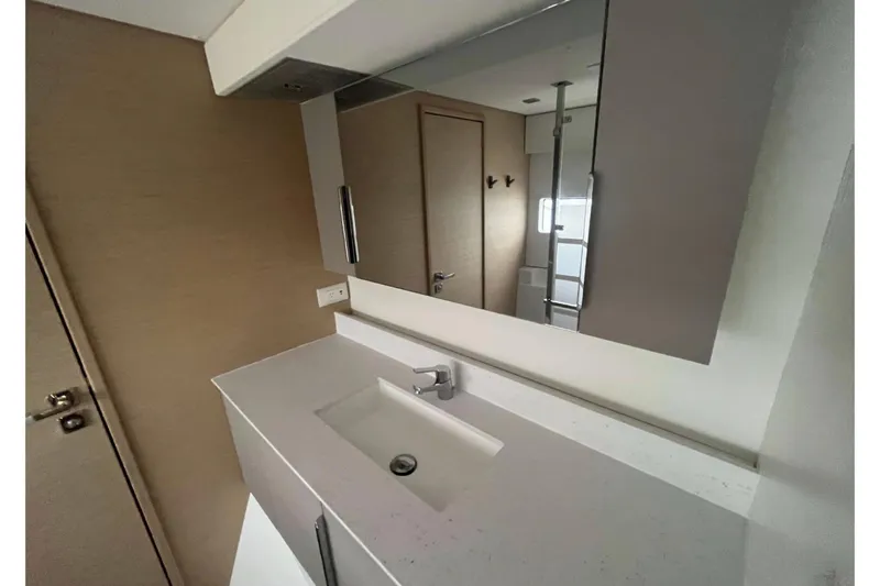 Fonn Taistil Domhain Yacht Photos Pics Modern bathroom interior on 2025 Fountaine Pajot 41 yacht, featuring sleek sink and mirror.