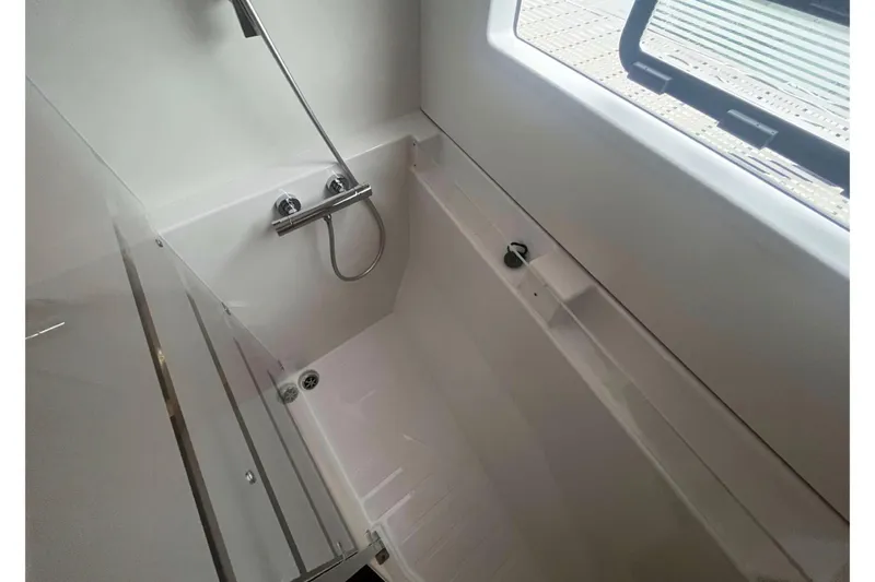 Fonn Taistil Domhain Yacht Photos Pics Modern bathroom in 2025 Fountaine Pajot 41 yacht with sleek shower design.