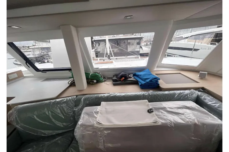 Fonn Taistil Domhain Yacht Photos Pics Interior of 2025 Fountaine Pajot 41 yacht with large windows and modern seating.