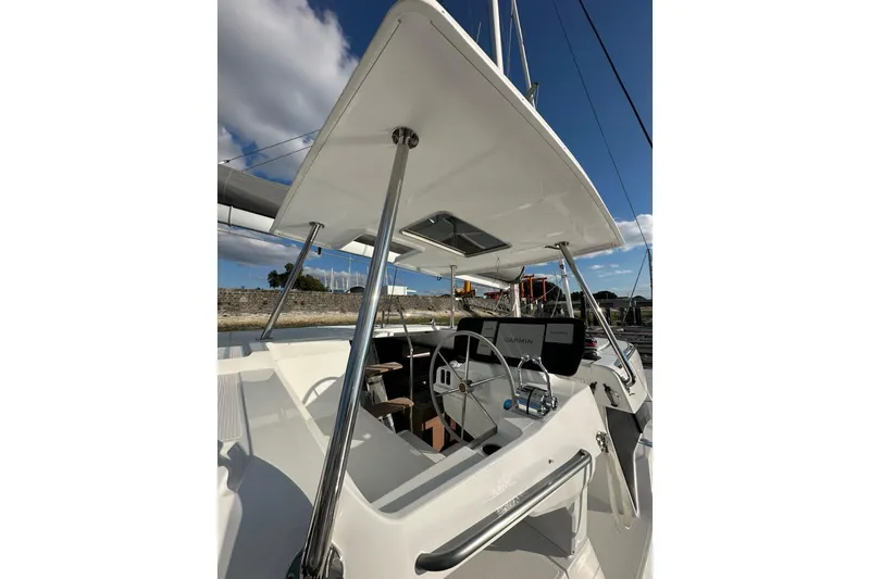 Fonn Taistil Domhain Yacht Photos Pics 2025 Fountaine Pajot 41 yacht cockpit with steering wheel and navigation equipment.