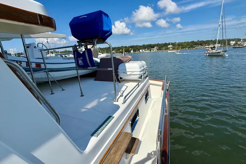 Destiny Yacht Photos Pics 1997 Sabre Sabreline 47 yacht docked in a scenic marina with sailboats.