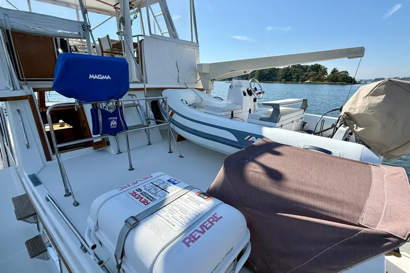 Destiny Yacht Photos Pics 1997 Sabre Sabreline 47 yacht deck with equipment and inflatable boat.