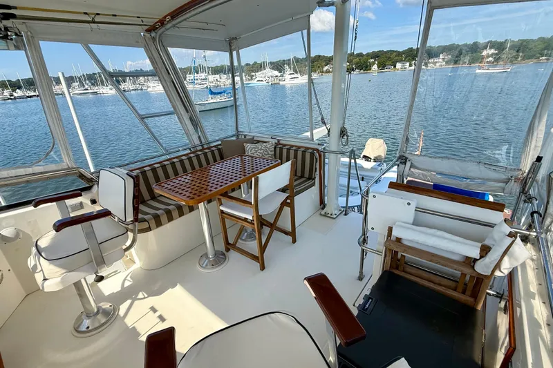 Destiny Yacht Photos Pics Spacious deck of 1997 Sabreline 47 yacht with seating and scenic marina view.