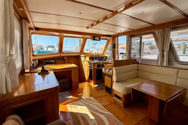 Destiny Yacht Photos Pics Luxurious interior of 1997 Sabreline 47 yacht with wood finish and spacious seating area.