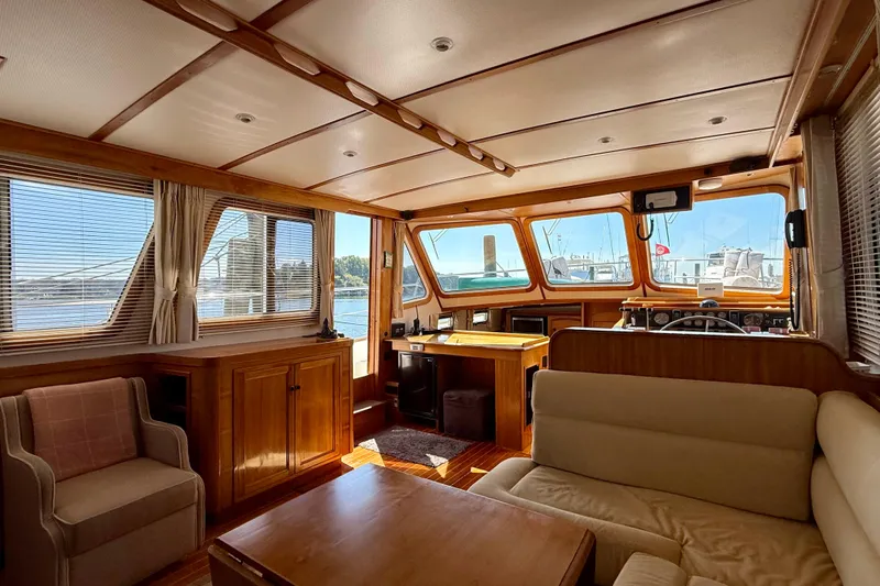 Destiny Yacht Photos Pics Interior of 1997 Sabre Sabreline 47 yacht with wood paneling and comfortable seating.