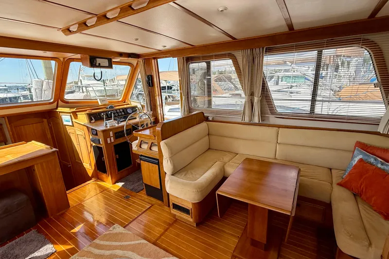 Destiny Yacht Photos Pics Interior of 1997 Sabre Sabreline 47 yacht with wooden finishes and beige seating.