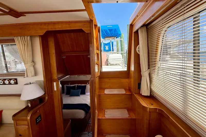 Destiny Yacht Photos Pics Interior of 1997 Sabreline 47 yacht with wooden stairs and cozy cabin.