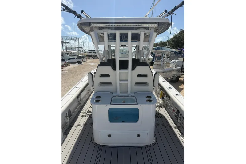  Yacht Photos Pics 2024 Tidewater 3100 Carolina Bay boat interior with seating and storage compartments.