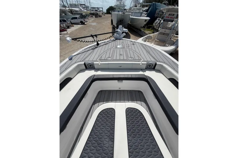  Yacht Photos Pics 2024 Tidewater 3100 Carolina Bay boat interior with sleek deck design and spacious seating.