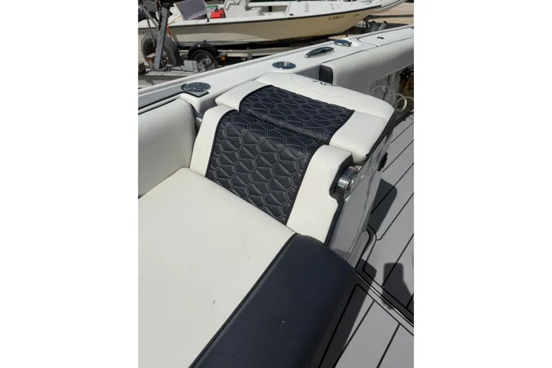  Yacht Photos Pics 2024 Tidewater 3100 Carolina Bay boat seat with stylish black and white upholstery.