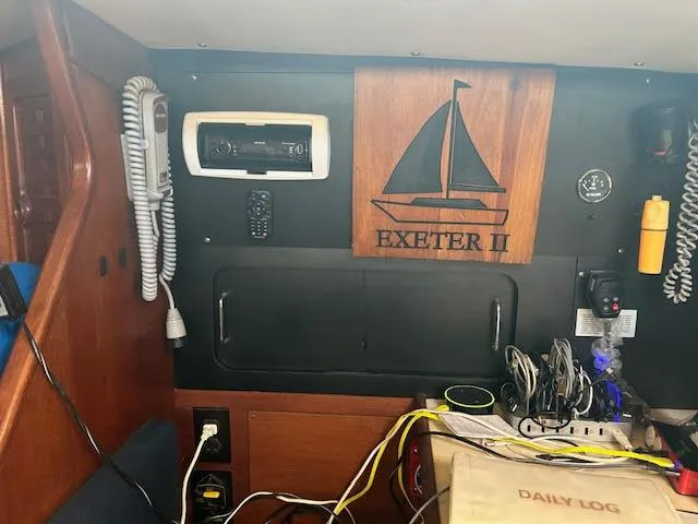Exeter II Yacht Photos Pics Interior of 1988 Sabre 38 sailboat with navigation equipment and Exeter II plaque.