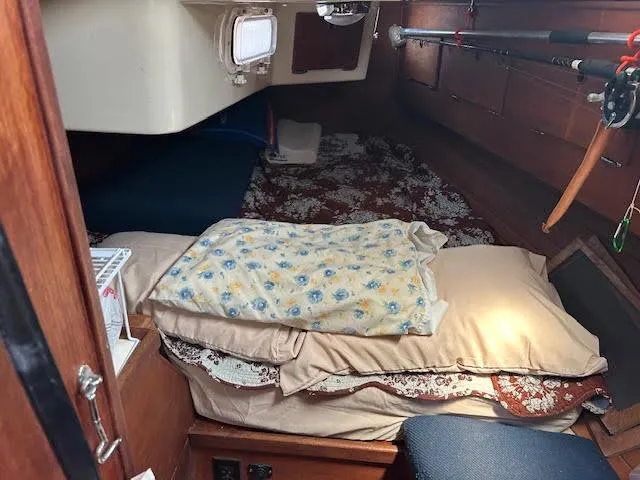Exeter II Yacht Photos Pics Interior cabin of 1988 Sabre 38 sailboat with bedding and storage.