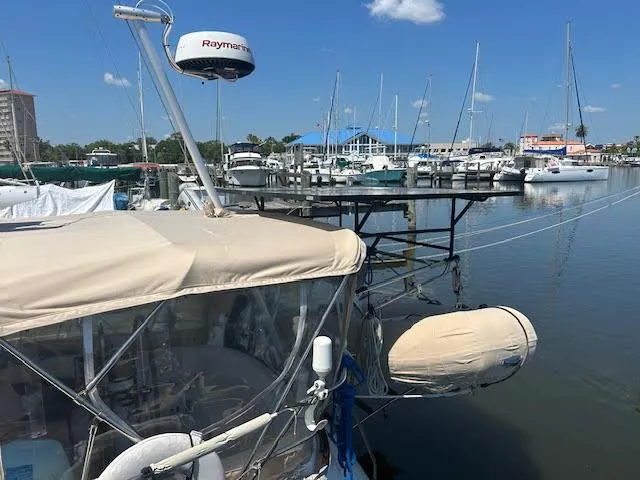 Exeter II Yacht Photos Pics 1988 Sabre 38 sailboat docked at a marina with other boats.