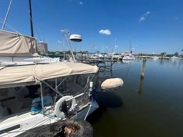 Exeter II Yacht Photos Pics 1988 Sabre 38 sailboat docked at a marina on a sunny day.