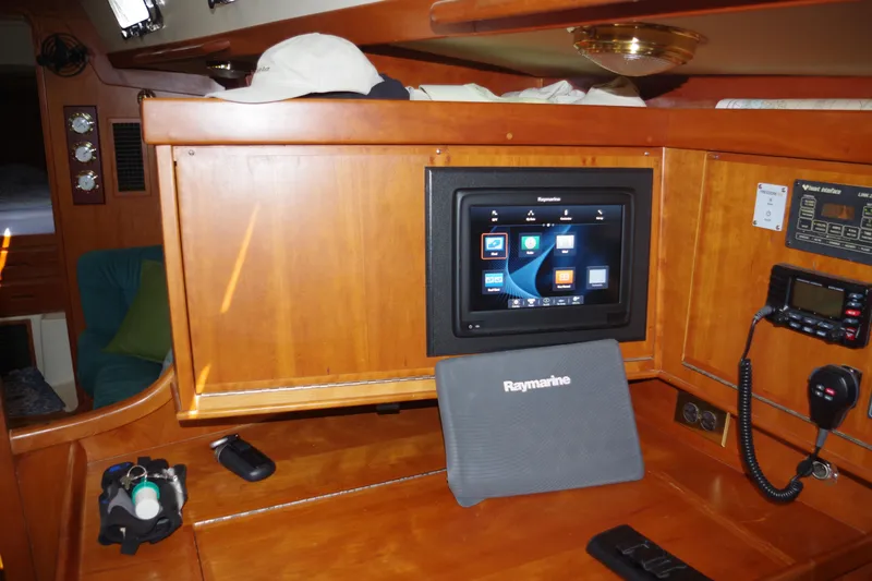 4869tw Yacht Photos Pics Navigation station inside a 2001 Tartan 4100 yacht with Raymarine equipment.