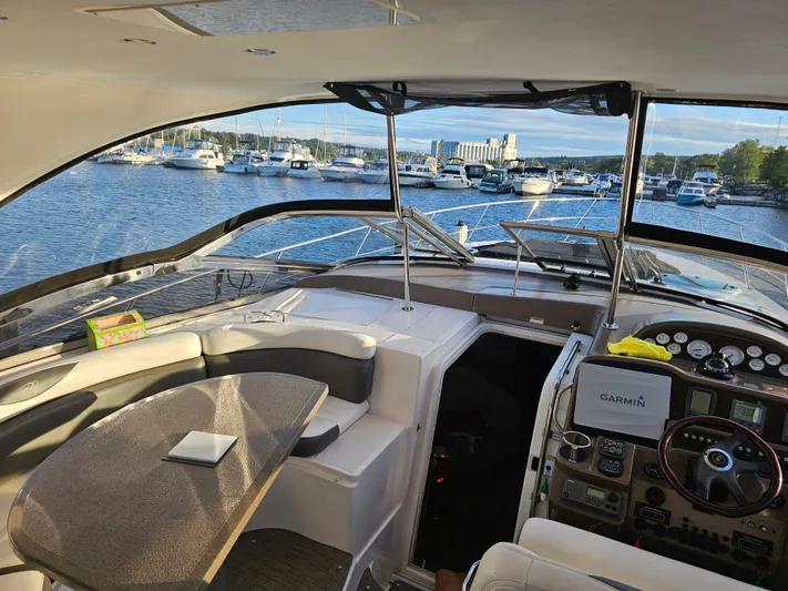  Yacht Photos Pics Interior view of 2005 Regal Commodore 4260 yacht with marina backdrop.