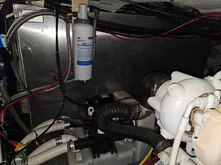  Yacht Photos Pics Engine compartment of a 2005 Regal Commodore 4260 boat, showing mechanical components and wiring.