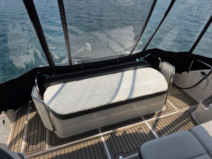  Yacht Photos Pics 2005 Regal Commodore 4260 boat interior with cushioned seating and teak flooring.