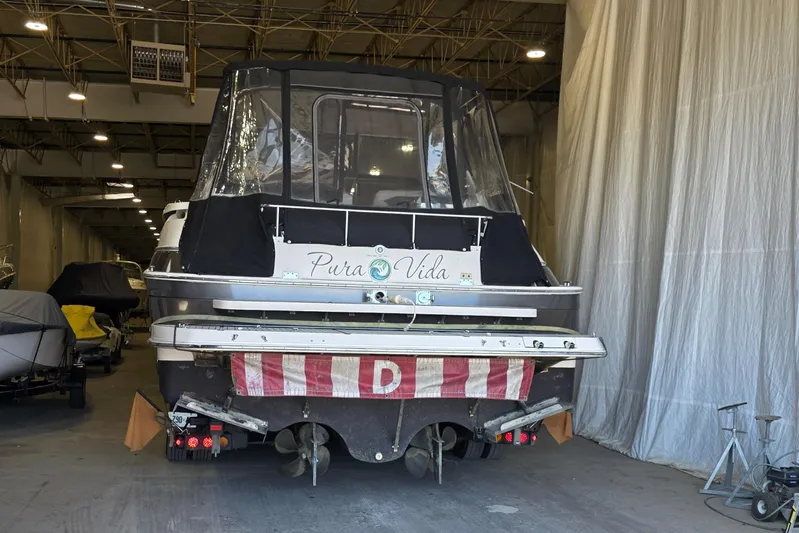  Yacht Photos Pics 2005 Regal Commodore 4260 boat in storage, rear view with protective cover.