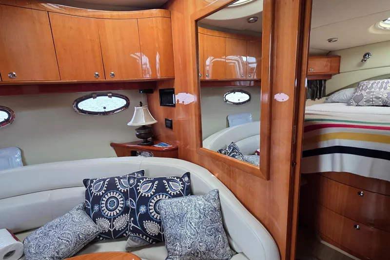  Yacht Photos Pics Luxurious interior of 2005 Regal Commodore 4260 yacht with elegant wood finish and plush seating.