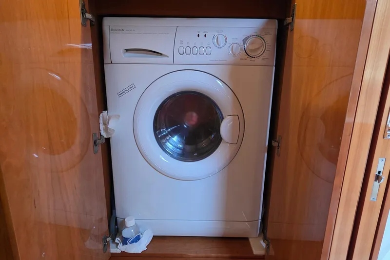  Yacht Photos Pics Washing machine inside a wooden cabinet on a 2005 Regal Commodore 4260 yacht.