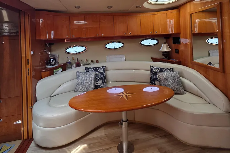  Yacht Photos Pics Luxurious 2005 Regal Commodore 4260 yacht interior with elegant seating and wooden accents.