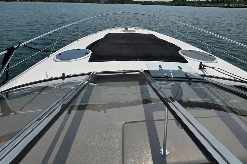  Yacht Photos Pics 2005 Regal Commodore 4260 yacht deck view on calm water.