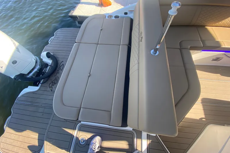  Yacht Photos Pics 2022 Sea Ray SDX 270 Outboard boat with tan seating and deck, docked by water.