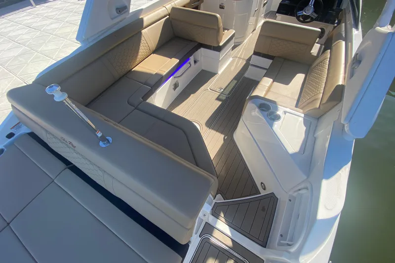  Yacht Photos Pics 2022 Sea Ray SDX 270 Outboard interior with beige seating and modern design.